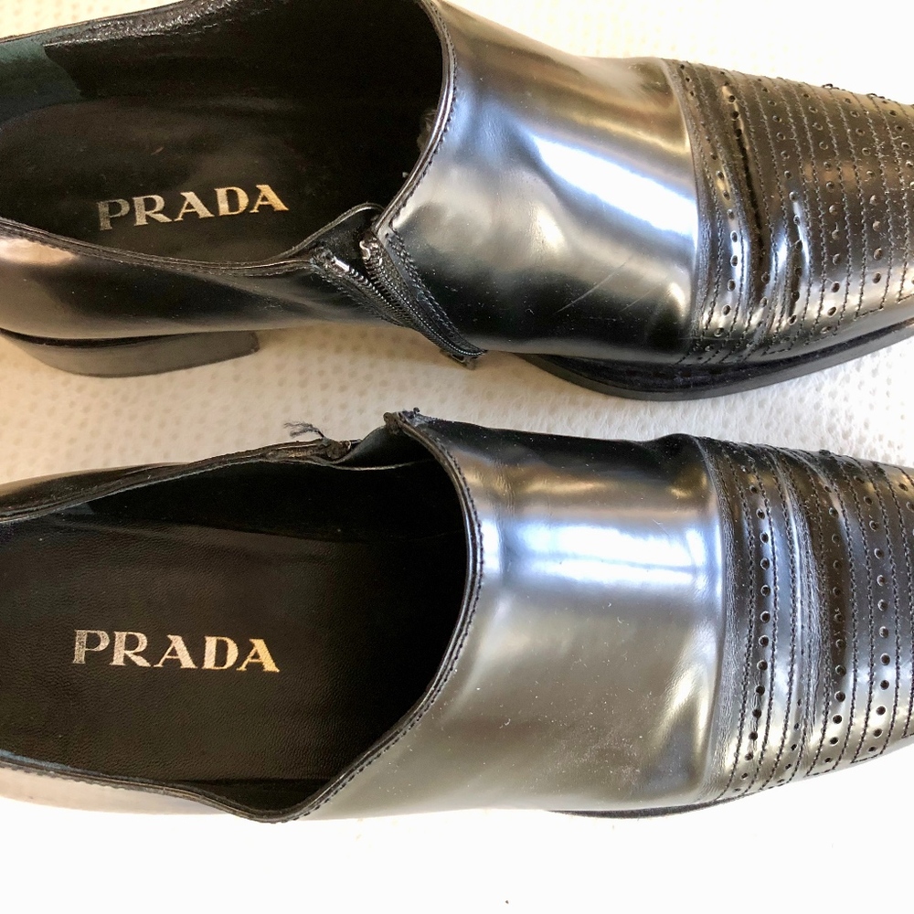 Prada black leather zipper low boots.